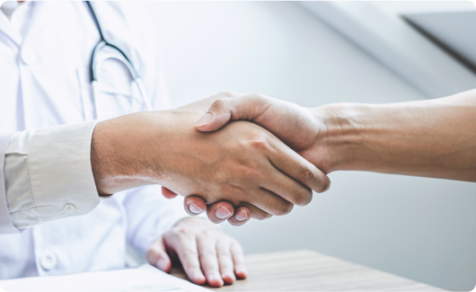 Shaking hands with medical employee.