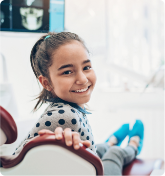 Girl smiling at dentist.